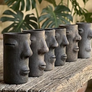 May include: A rustic wooden sign with the text "Welcome to our home" in white lettering. The sign features a distressed finish and a simple, inviting design, perfect for entryway decor.