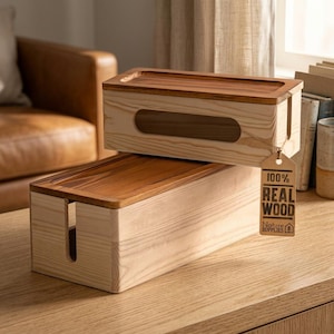 May include: Two rectangular wooden cable organizers with light wood bodies and darker wood lids. One box is stacked on top of the other. Each box has a slot for cables and a cutout. A tag reads "100% REAL WOOD Nature Supplies".