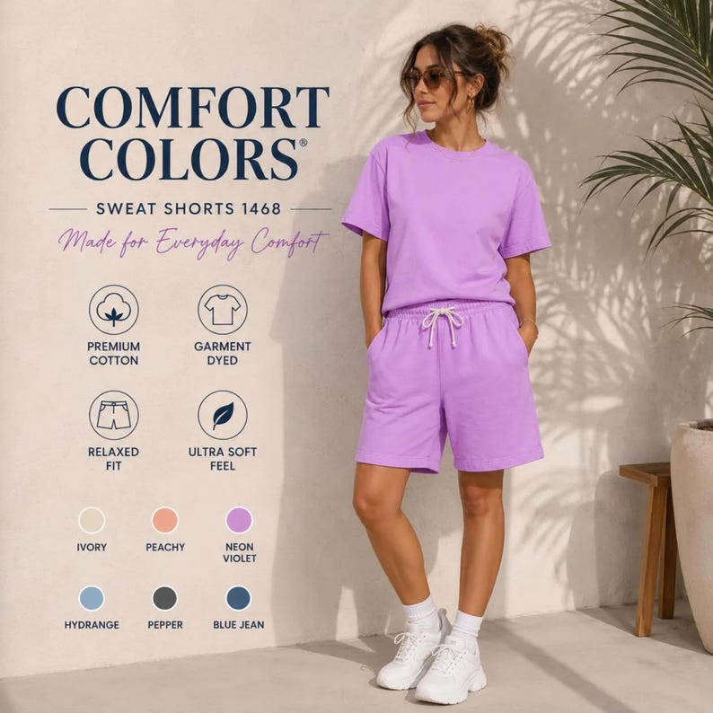 May include: A neon violet t-shirt and matching sweat shorts set featuring a drawstring waist. The text Comfort Colors Sweat Shorts 1468 Made for Everyday Comfort is visible along with icons for premium cotton, garment dyed, relaxed fit, and ultra soft feel.