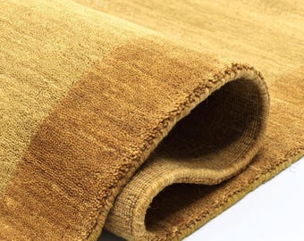 Golden Mustard And Tan Solid Handloom Wool Rug With Framed Border Minimal Area Rug Warm Earth Tone Handmade Modern Scandinavian Living Room