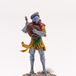May include: A miniature figurine of a medieval bard playing a lute. The figure is painted in shades of gray, red, yellow, and green, with a blue hat. The base is brown and textured. The figurine is set against a white background.