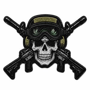 May include: An embroidered patch featuring a white human skull wearing a black tactical helmet, green goggles, and ear protection. Two black rifles are crossed behind the skull, creating a symmetrical design with detailed stitching throughout.