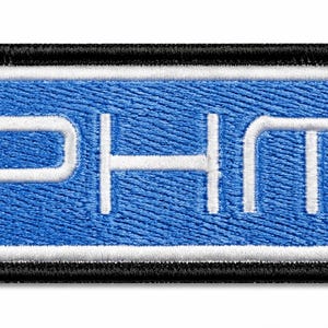 May include: A rectangular embroidered patch featuring the letters PHM in white thread centered on a blue background. The design is framed by a thin white border and a thick black outer border, creating a clean and structured appearance.