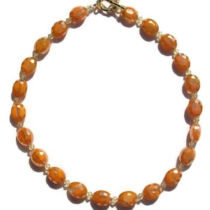 Beautiful orange-yellow glass bead choker with light yellow crystals beads.