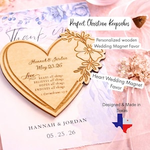 May include: A wooden heart-shaped wedding magnet favor with floral accents. The magnet is engraved with names, a date, and a Bible verse. The text "Perfect Christian Keepsakes" is also visible.