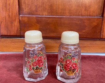 Vintage salt and pepper shakers with basket of roses design