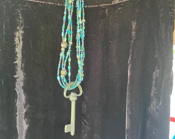 Handmade multi-strand beaded necklace with lapis lazuli beads, sterling silver elements and an antique skeleton key
