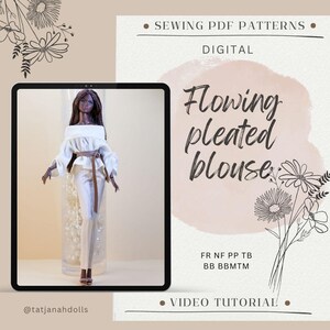 May include: A digital sewing pattern for a flowing pleated blouse, displayed on a tablet. The doll model wears a white off-the-shoulder blouse and matching pants, cinched with a brown belt. The image includes text that says "Flowing pleated blouse" and "Sewing PDF Patterns".
