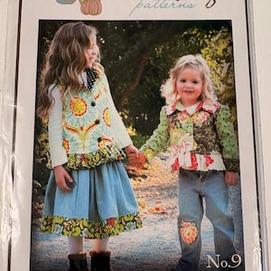 May include: A sewing pattern package featuring two young girls wearing quilted jackets and vests. The package has the text "pink fig patterns" and "the Patty Jacket & Vest". The girls are holding hands and wearing colorful floral designs.