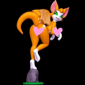 May include: A 3D rendered figurine of an orange creature with large ears, green eyes, and small wings, standing on a grey rock base. The creature has white paws and tail markings, with two pink heart-shaped icons obscuring parts of its body.