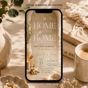 May include: A smartphone displaying a digital housewarming invitation with the text HOME SWEET HOME, YOU'RE INVITED TO A HOUSEWARMING CELEBRATION, Charlotte & James, Sunday June 21 2026 at 6:30 PM, 245 Willow Creek Lane, Austin, TX 78704, RSVP to Charlotte.