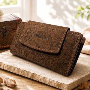 Cartera de piel auténtica para mujer con estampado floral en relieve, bloqueo RFID y cierre de cremallera.