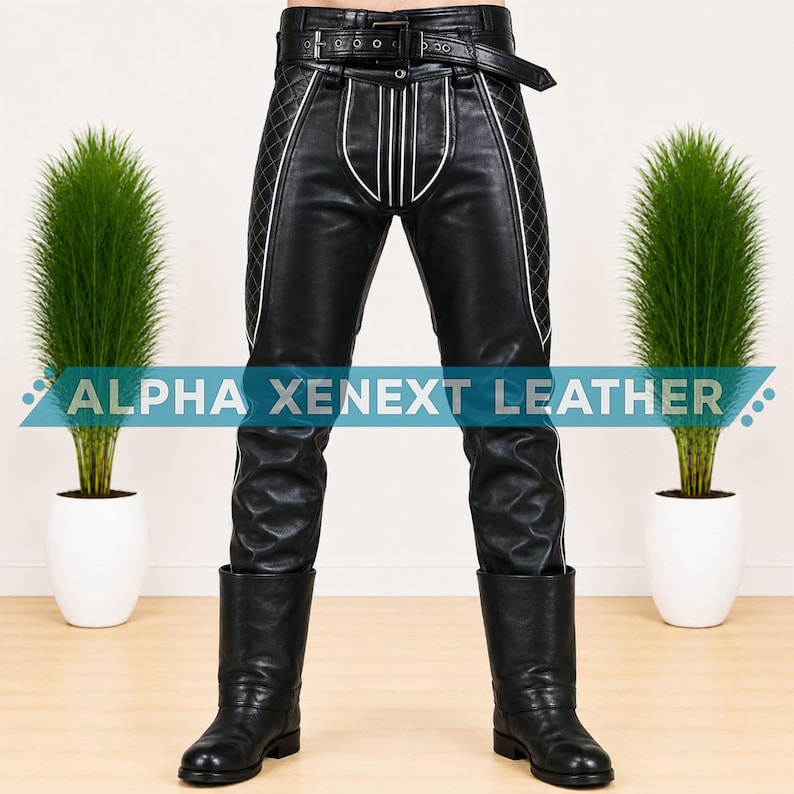 May include: Black leather pants featuring a quilted diamond pattern on the outer thighs, white piping accents, and a buckled belt at the waist. The pants include the text ALPHA XENEXT LEATHER across the front and are paired with black leather boots.