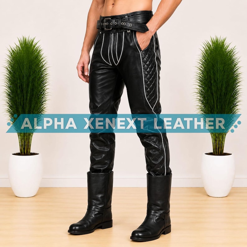 May include: Black leather pants featuring a quilted side panel, white piping accents, and an integrated belt with a metal buckle. The pants display the text ALPHA XENEXT LEATHER across the front. The garment is paired with black leather boots.
