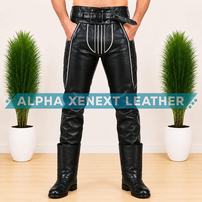 May include: Black leather pants featuring a high-waisted belt with a buckle, white piping accents on the front pockets, and quilted side panels. The pants are paired with black leather boots. The text ALPHA XENEXT LEATHER is visible.