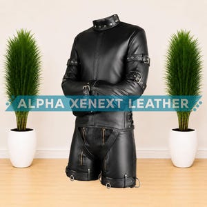 May include: A black leather garment featuring a high collar with metal studs, long sleeves with buckled straps, and shorts with dual front zippers and lower leg straps. The text ALPHA XENEXT LEATHER is displayed across the center of the image.