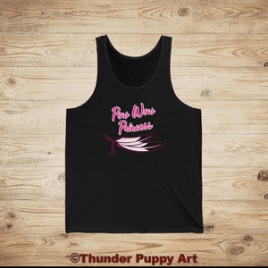 May include: Black tank top with a pink graphic of a feather and the text "Pow Wow Princess".