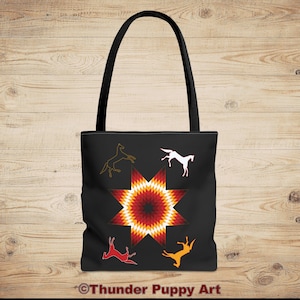 May include: Black tote bag featuring a red, orange and yellow geometric star design. Four stylised horses are arranged around the star, two black, one white and one orange.