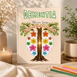 May include: A coloring book with a cream cover featuring the green text DEMENTIA, the black text Mirror Image, and red text Coloring Book for Seniors. The design shows a tree with a brain-shaped trunk and colorful flower illustrations.