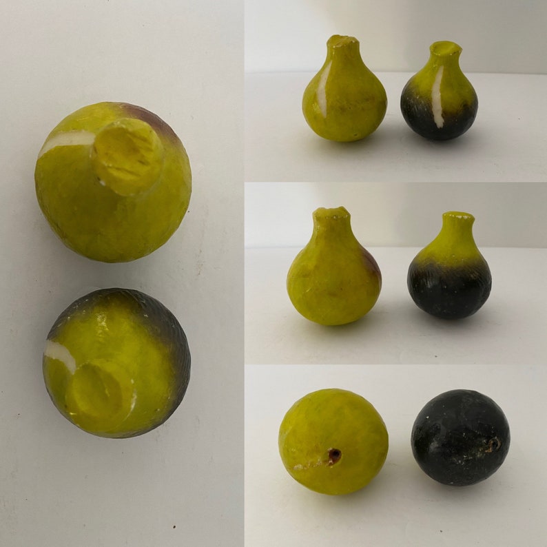 May include: Set of six hand-painted ceramic fig ornaments. The ornaments are in two colors: green and black. The green ornaments have a white stripe around the middle. The black ornaments have a white stripe around the top.