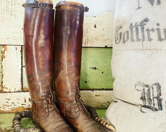 Antique pair of  leather boots with the original lasts or boot form / stretchers.