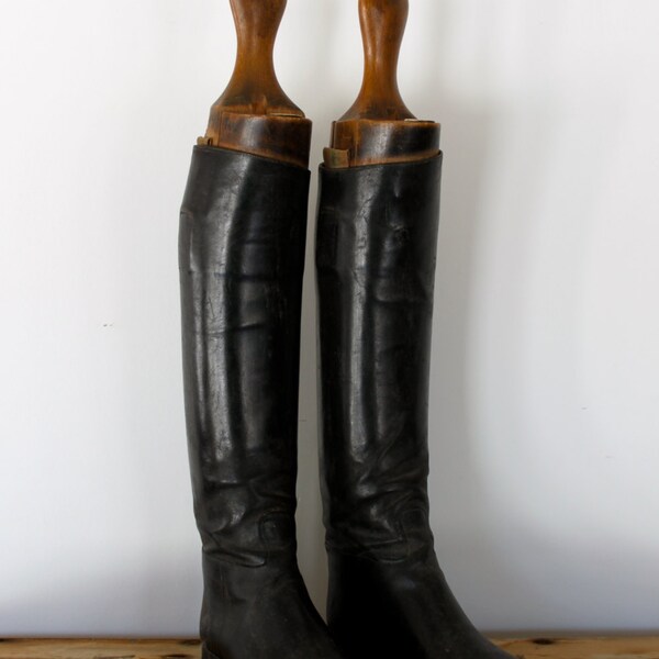 Antique pair of leather boots with the original lasts or boot form / stretchers.
