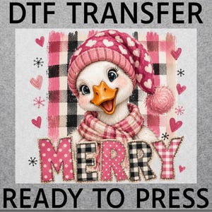 May include: A DTF transfer sheet featuring a white duck wearing a pink heart-patterned winter hat and a pink plaid scarf. The background includes a pink and black plaid square, pink hearts, and snowflakes. The word MERRY is printed in large letters.
