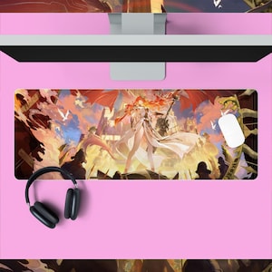 May include: A rectangular mousepad featuring a fantasy illustration of a woman with red hair and white clothing, set against a backdrop of a city and a cloudy sky. A white mouse and black headphones are also visible.