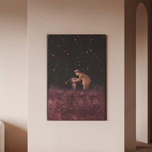 May include: A framed art print depicts a person in a brown coat interacting with another figure in a field of tall, reddish-purple grass under a dark sky with glowing orbs. The artwork is displayed on a light-colored wall.