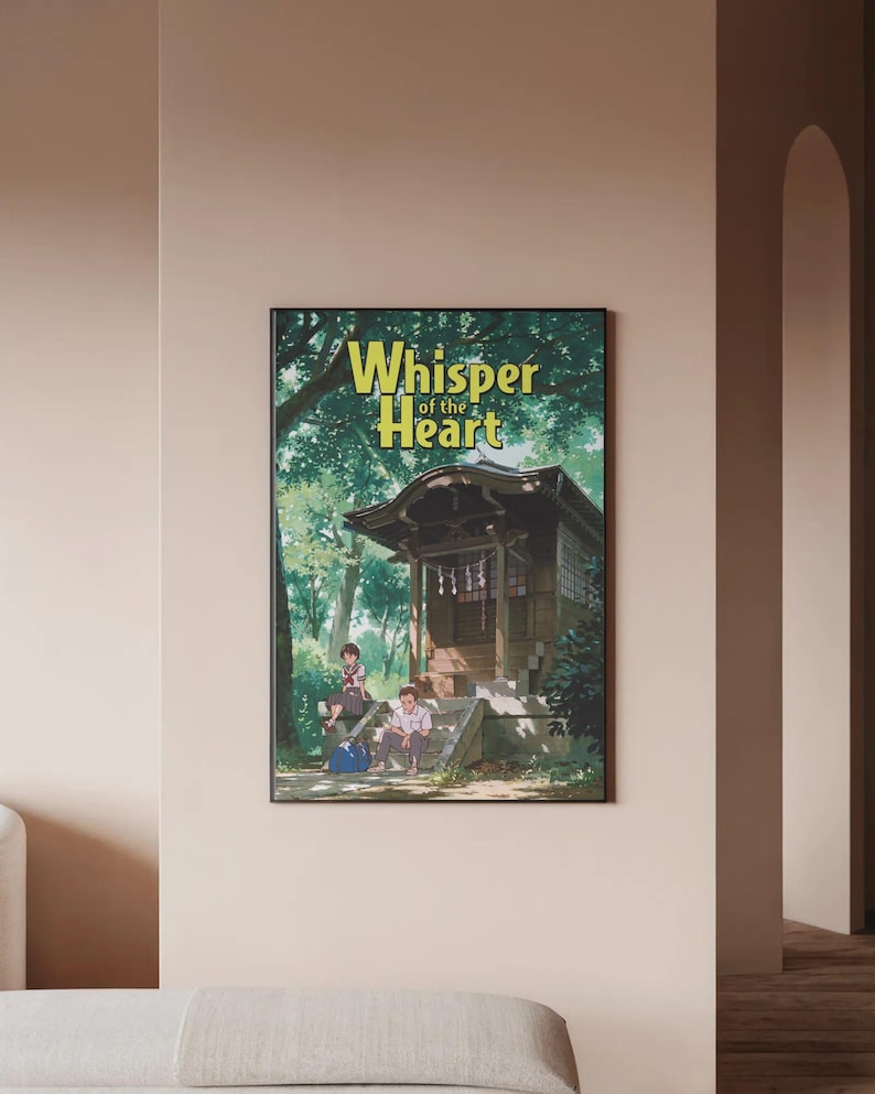 May include: A framed poster for the anime film "Whisper of the Heart." The image shows a traditional Japanese building with two people sitting on steps. The title, in yellow and green, is set against a backdrop of trees.