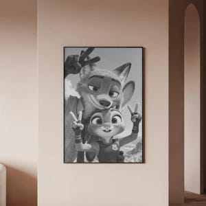 May include: A black and white framed wall art print featuring a fox and a rabbit character posing together. Both characters are making a peace sign gesture with their hands. The fox is positioned behind the rabbit, and both are smiling.