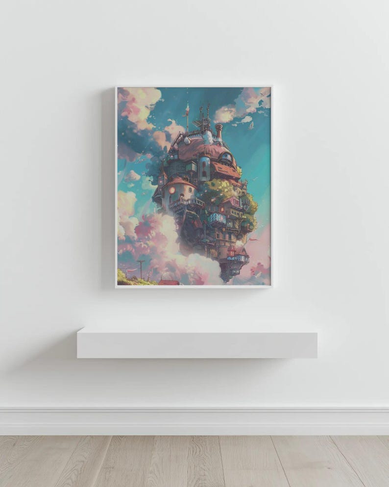 May include: A framed art print depicts a whimsical, multi-story building floating in a cloudy sky. The building has a red roof, multiple windows, and is surrounded by lush greenery. The artwork is set against a backdrop of blue and pink clouds.
