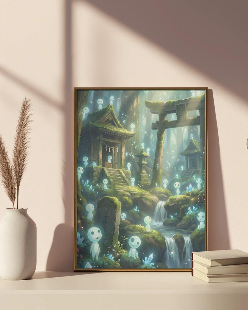 May include: Framed art print depicting a serene forest scene with a waterfall, traditional Japanese structures, and glowing spirit figures. The artwork features a gold frame and is displayed on a white surface with a vase and books.