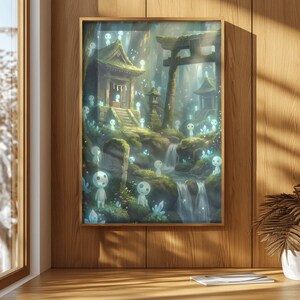 May include: Framed art print depicting a serene forest scene with a waterfall, traditional Japanese structures, and glowing spirit figures. The artwork is set in a wooden frame and displayed on a wooden surface.