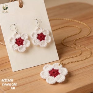 May include: A white and red crochet flower jewelry set, including earrings and a necklace. The earrings are attached to a cream-colored card. The necklace has a gold chain. The text "INSTANT DOWNLOAD PDF" is visible.