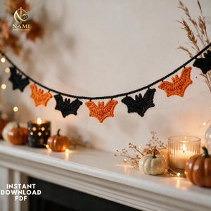 May include: A decorative garland featuring alternating crocheted bat shapes in solid black and vibrant orange yarn. The bats are evenly spaced and attached to a thin black cord, creating a festive hanging display for seasonal decor.