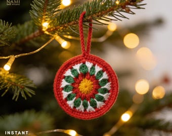 May include: A round, crocheted Christmas ornament featuring a central yellow circle surrounded by alternating green and white petal-like patterns, all enclosed within a red border and finished with a matching red yarn hanging loop.
