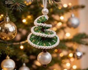 May include: A spiral-shaped Christmas tree ornament crocheted in dark green yarn with white trim and metallic gold accents. The ornament features a white pearl bead at the top loop and a larger white pearl bead hanging from the bottom center point.