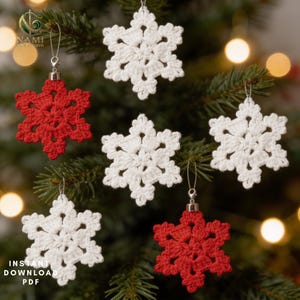 May include: A collection of six crocheted snowflake ornaments in solid white and red colors. Each snowflake features a six-pointed star design with intricate stitching, attached to a silver-toned metal cap and a thin hanging loop for display.
