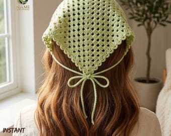 May include: A light green, crocheted head covering with a square shape and a bow tie in the back. The text "INSTANT DOWNLOAD PDF" is visible in the lower left corner. The head covering is made of a light green yarn.