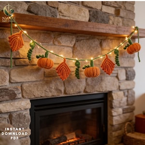 May include: A crochet garland featuring orange pumpkins and orange leaves connected by a green vine string with small white fairy lights. The garland displays alternating pumpkin and leaf shapes with green stems and curly tendrils throughout the length.
