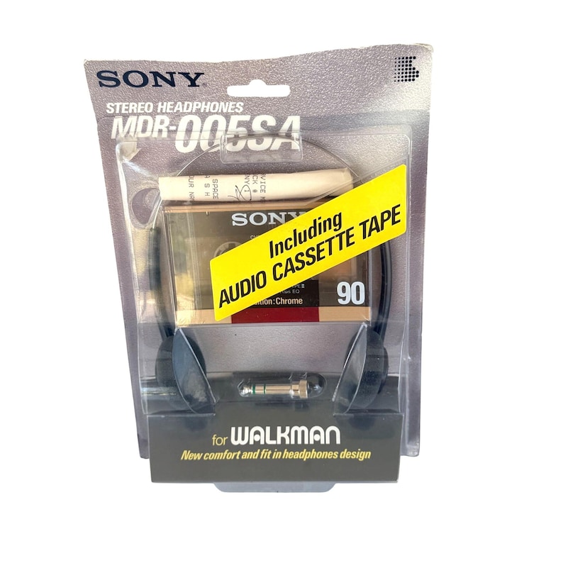 May include: Sony MDR-005SA stereo headphones in original blister packaging. The package includes a 90-minute audio cassette tape and a headphone jack adapter. The branding includes the text Sony, MDR-005SA, and Walkman on the cardboard backing.