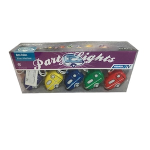 May include: A pack of retro trailer party lights. The lights are shaped like colourful campers in yellow, blue, green, and red. The packaging reads "Party Lights" and "Retro Trailers".
