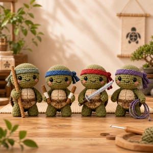 May include: Four crocheted turtle dolls with green bodies and tan shells. Each wears a different colored headband: green, blue, red, and purple. They hold miniature accessories including a wooden staff, two nunchucks, a silver sword, and a purple rope.