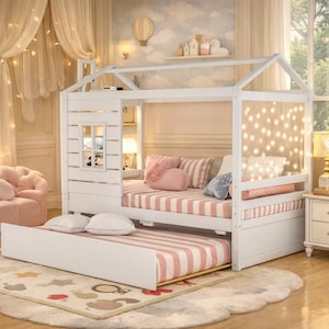 May include: White wooden house-shaped bed frame with a trundle bed. The bed has a striped mattress and is decorated with pillows. The room has a whimsical theme with a cloud mural and fairy lights.