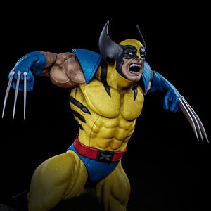 May include: A detailed figurine of Wolverine in a dynamic pose, with claws extended. The figure features a yellow and blue costume, a black mask, and a red belt. The character's face shows an angry expression.