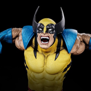 May include: A detailed figurine of Wolverine, a Marvel Comics character, in a dynamic pose. The figure features a yellow and blue costume with black accents, a mask, and exposed claws. The character's face is contorted in an angry expression, with bared teeth.