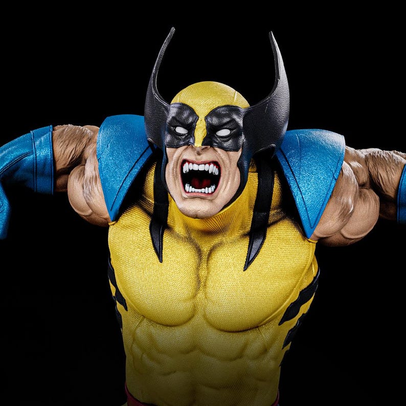 May include: A detailed figurine of Wolverine, a Marvel Comics character, in a dynamic pose. The figure features a yellow and blue costume with black accents, a mask, and exposed claws. The character's face is contorted in an angry expression, with bared teeth.
