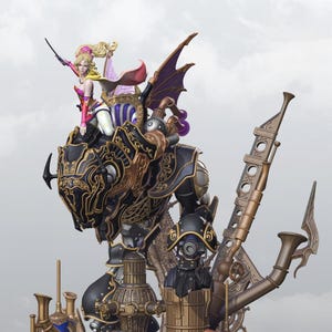 May include: A detailed figurine featuring a female character riding a mechanical construct. The figure is predominantly black and gold, with intricate detailing. The character is wearing pink and purple attire, with blonde hair. The base has a steampunk aesthetic.