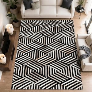 May include: A rectangular area rug featuring a repeating geometric pattern of black, white, and gray stripes arranged in a three-dimensional cube effect. The rug covers the floor space between two white sofas and a wooden media console.